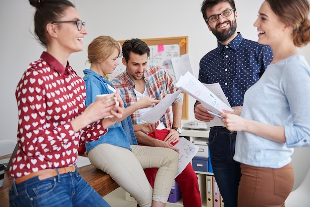 A group of boys and girls gathered together, smiling and engaged in a lively discussion. The image captures the essence of a positive and supportive companionship. 