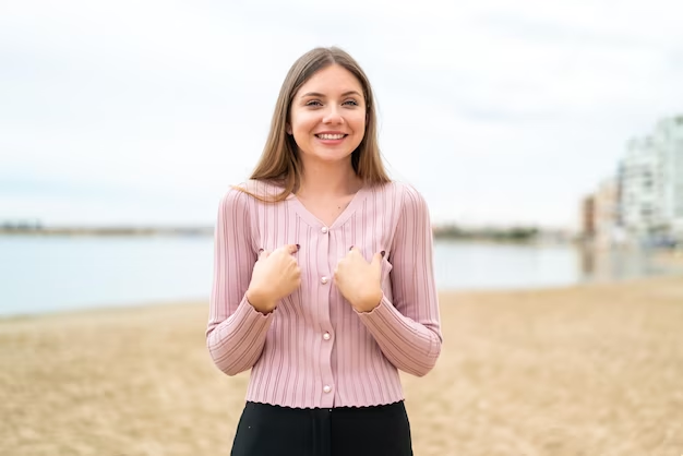 A cheerful girl with a bright smile, pointing at herself with an expression of gratitude and positive thought. Her joyful demeanor reflects her contentment and appreciation for what she has. 